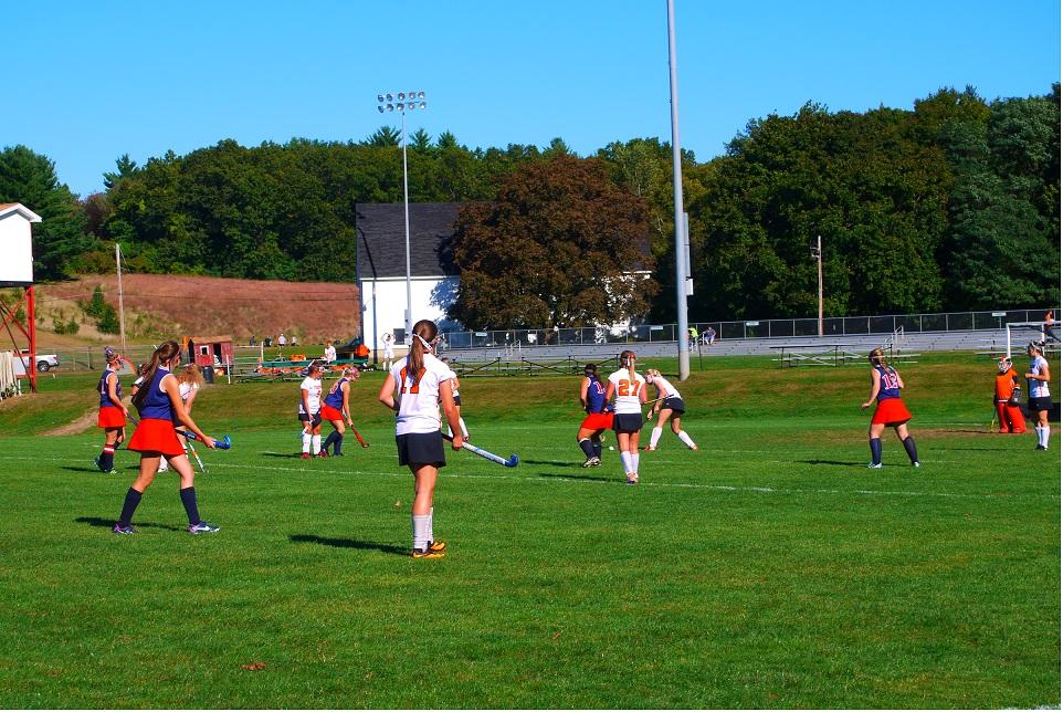 The field hockey team in their playoff game, giving it their all.