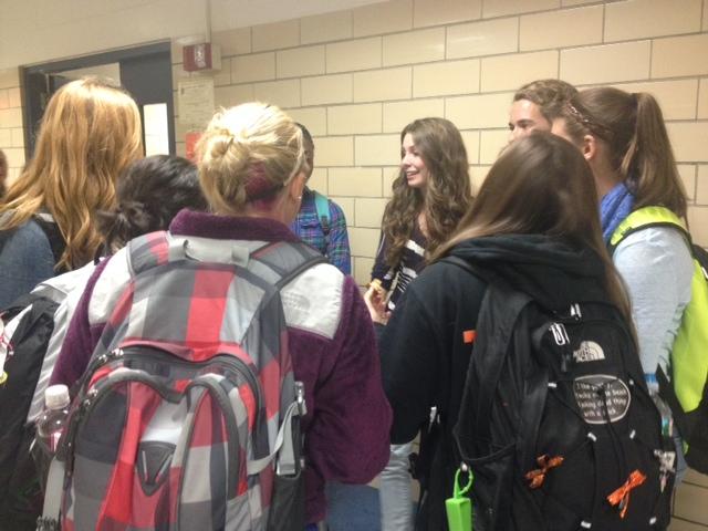A group of students stands outside of the cafeteria, enjoying their ten minute break before it was shortened.