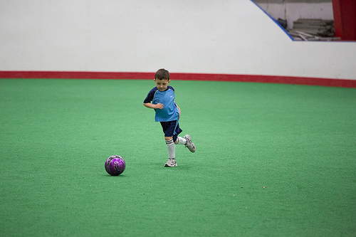 A young child embracing the sport of Soccer