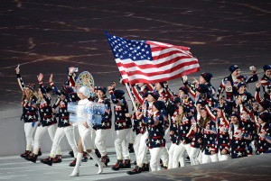 LET THE GAMES BEGIN: The American team parades out on the field.