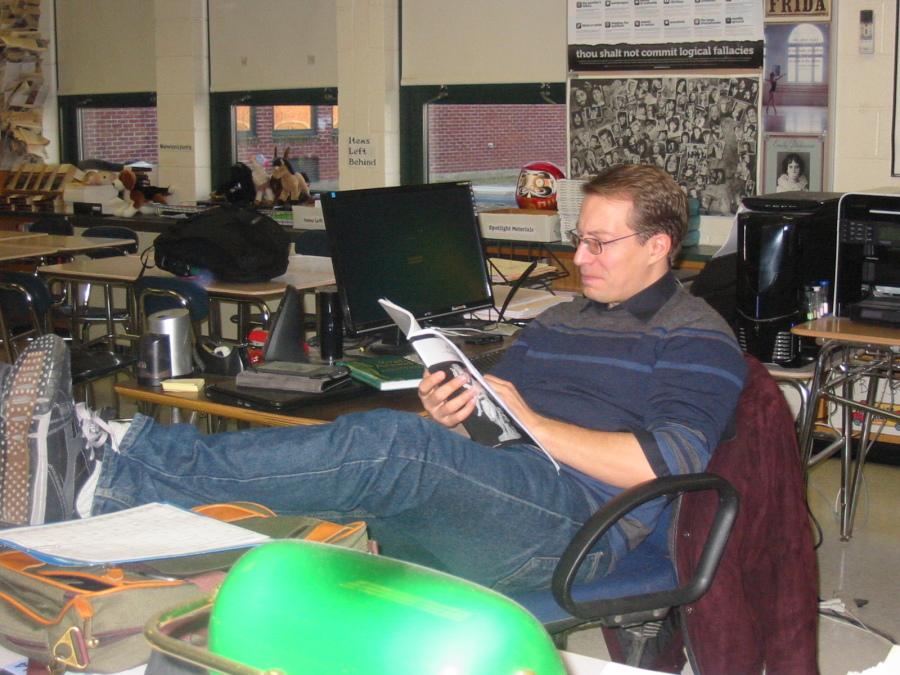 Mr. Swanbeck, who has taken over several English classes, enjoys a book.