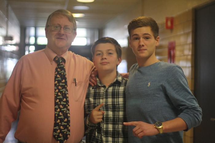 KING KELLY: Jonathan Kelly stands with two freshmen earlier
this year. Kelly was well known for his dramatic siege lesson where
students had to devise a successful plan to take over his castle