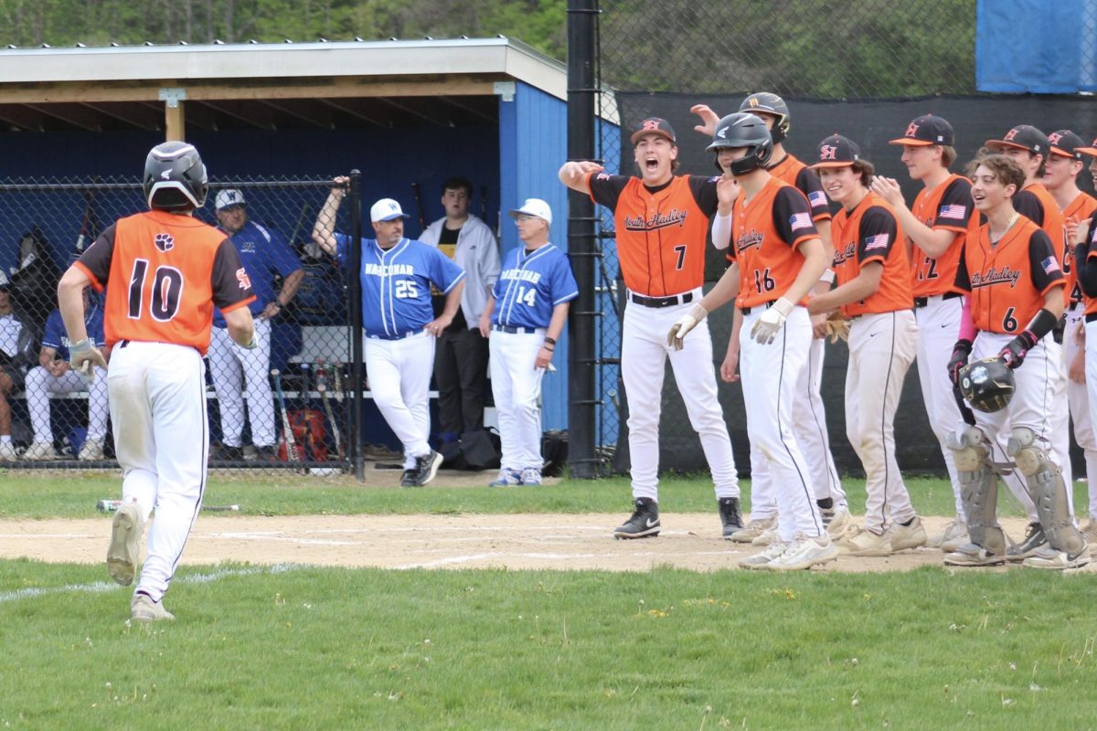 Noah Carillon heads home, celebrating his first varsity home run.