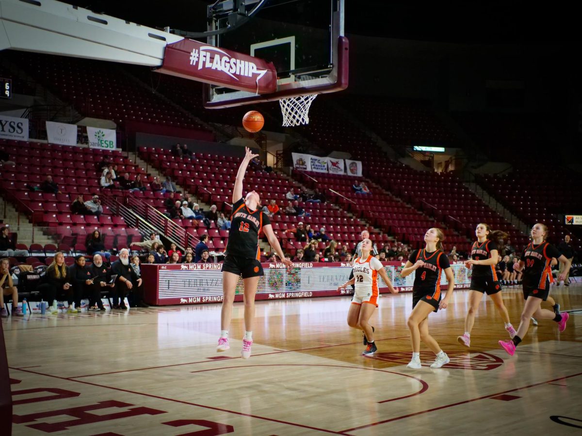 Cara Dean lays up the ball at the Mullins Center.